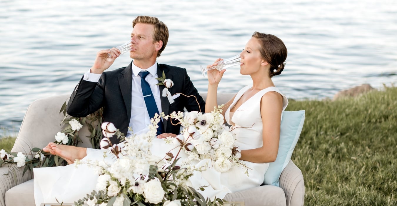 Couple celebrating wedding near lake