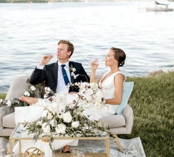 Couple celebrating wedding near lake