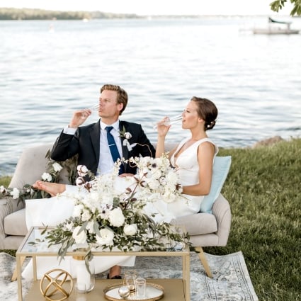 Couple celebrating wedding near lake