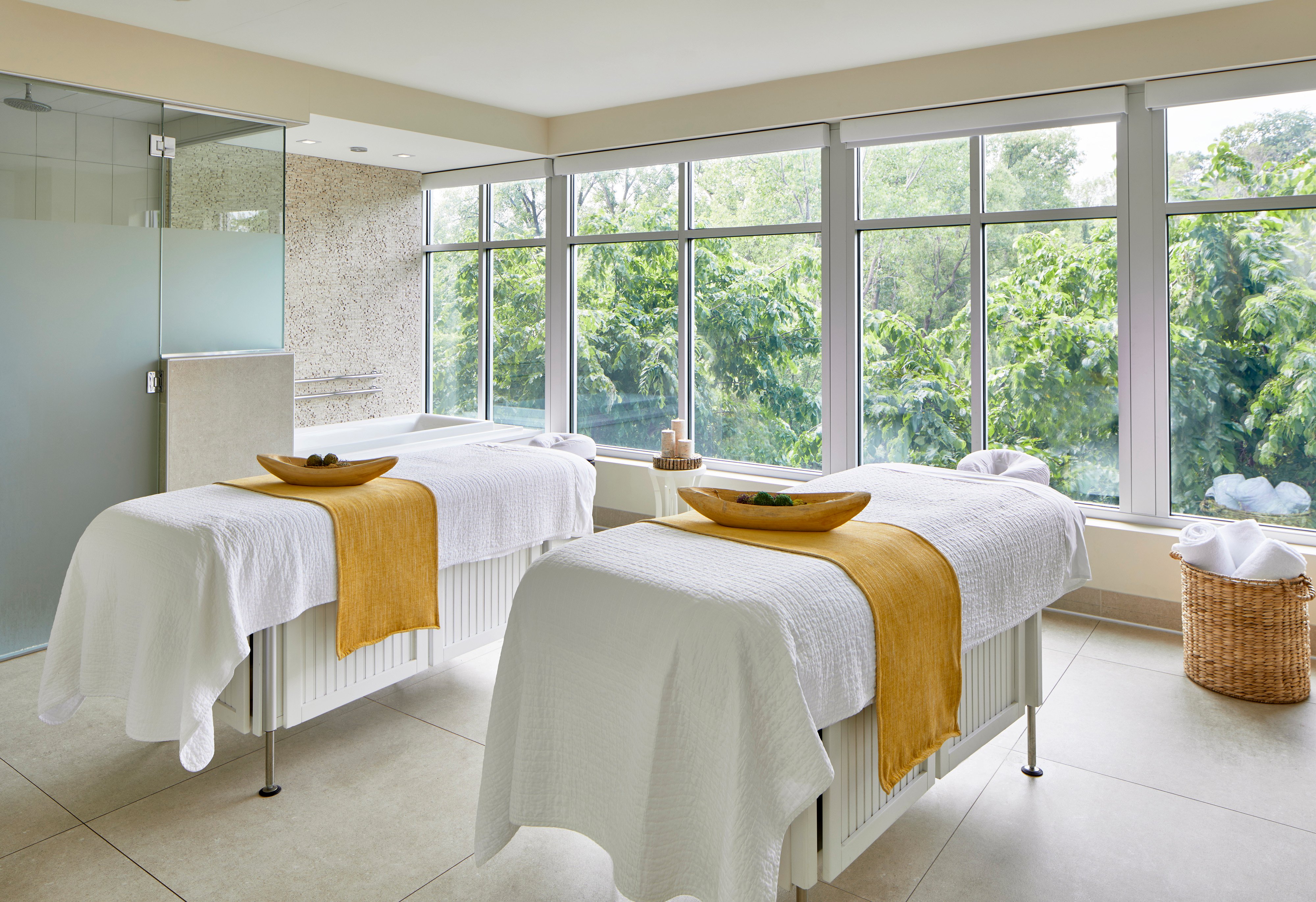 A woman relaxing at the spa with a cup of tea