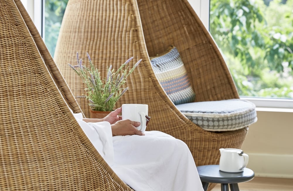 Person relaxing with cup of tea