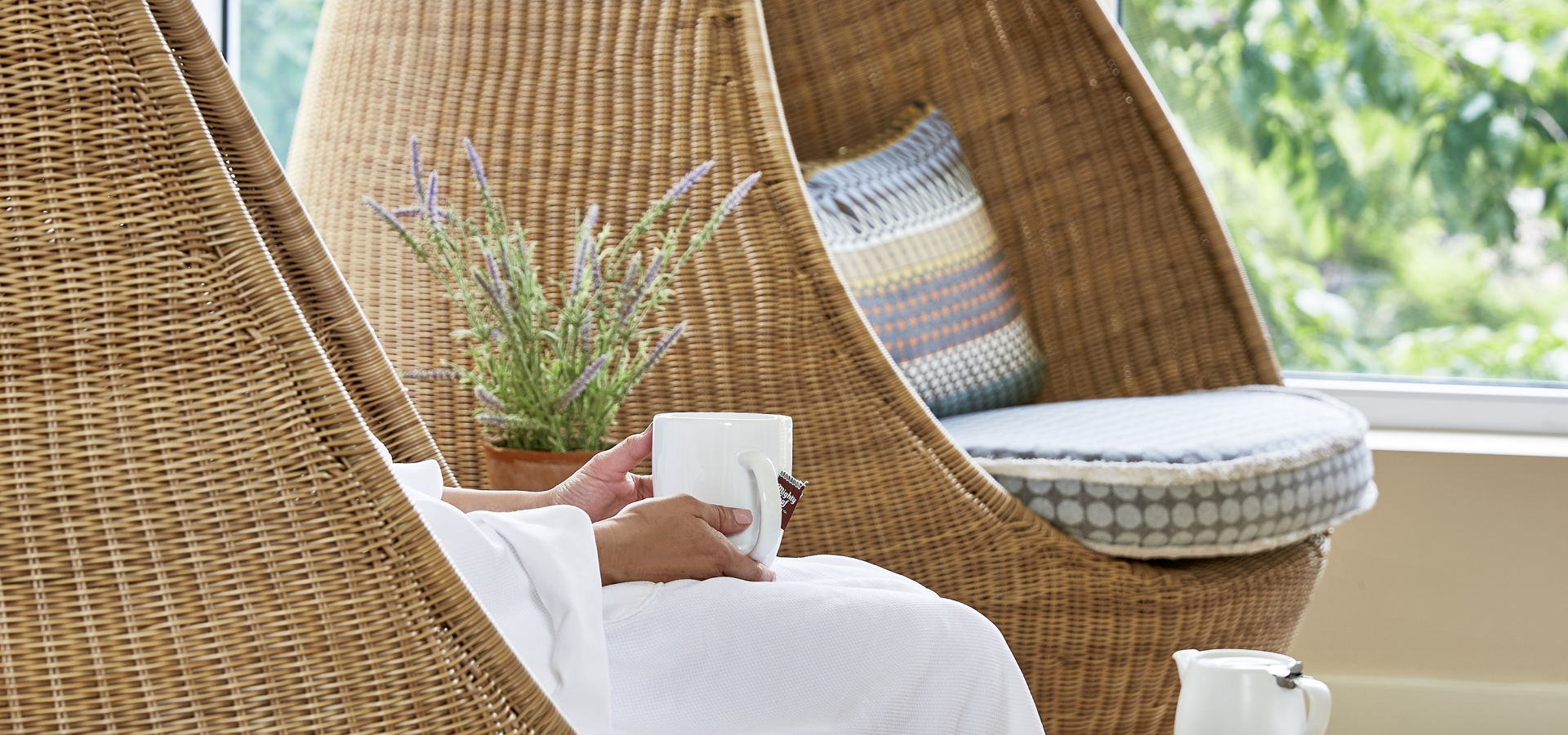 Person relaxing with cup of tea