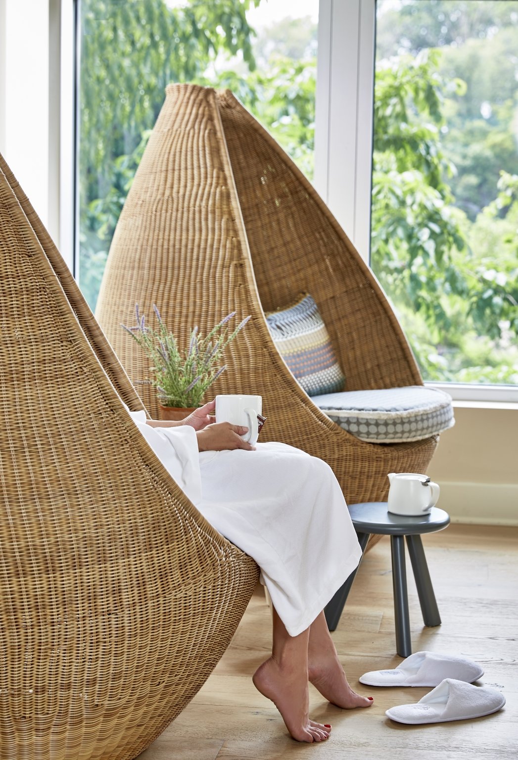 a woman relaxing at the spa with a cup of tea