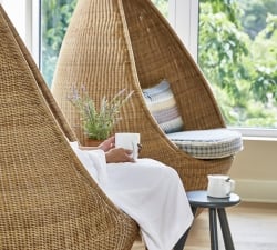 a woman relaxing at the spa with a cup of tea