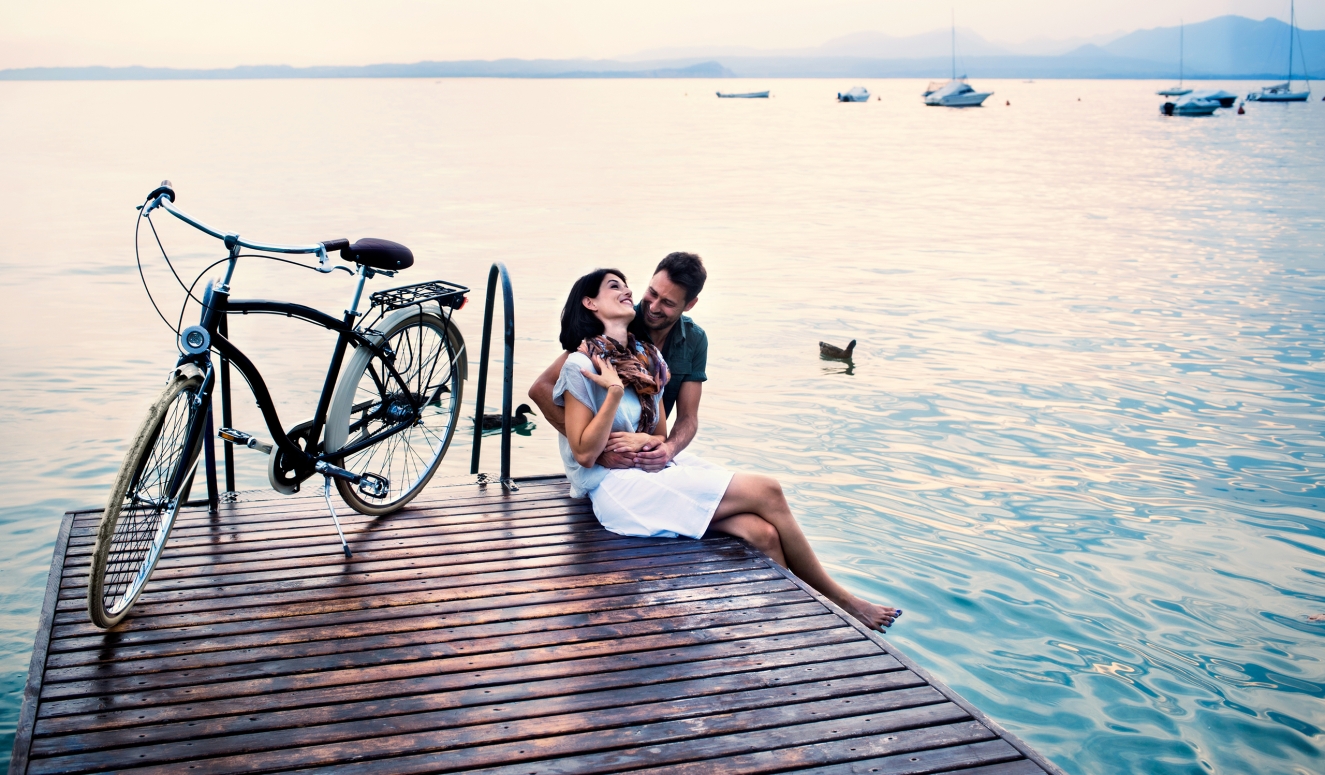 two guests with bike on pier