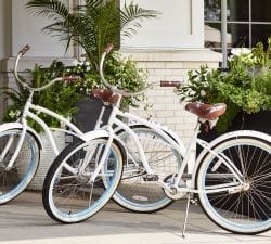 Cruiser bikes parked in front of hotel entrance
