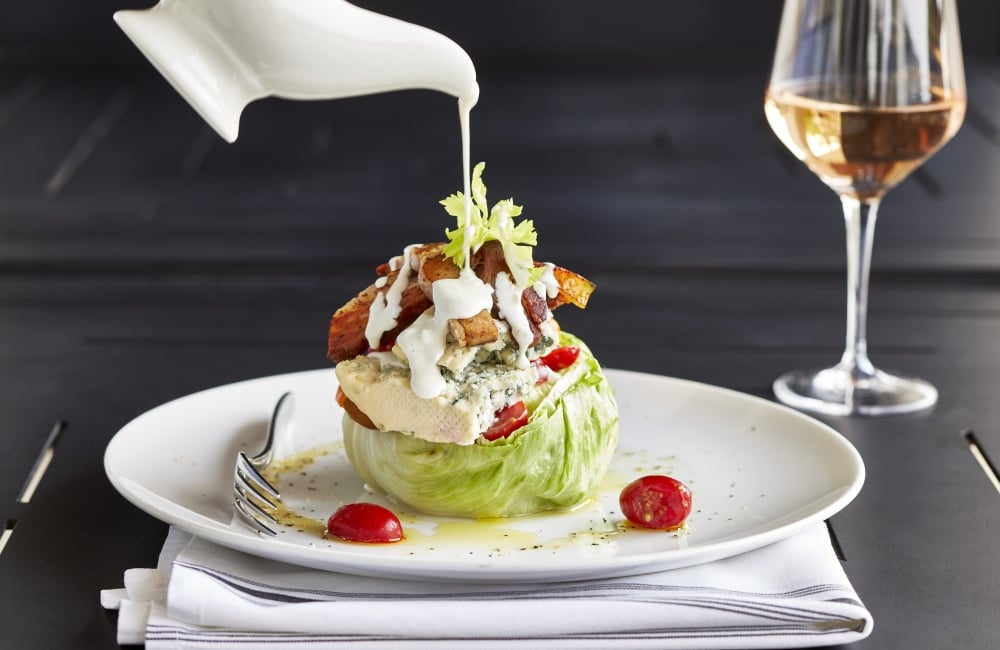 Wedge salad with glass of rose