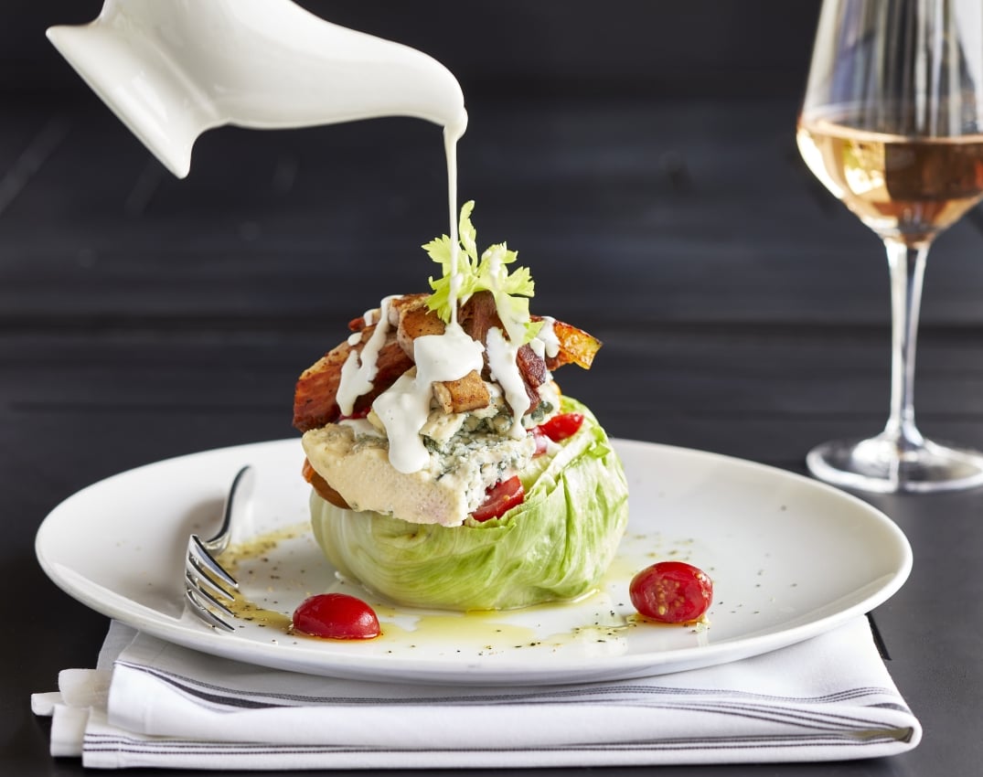 Wedge salad with glass of rose