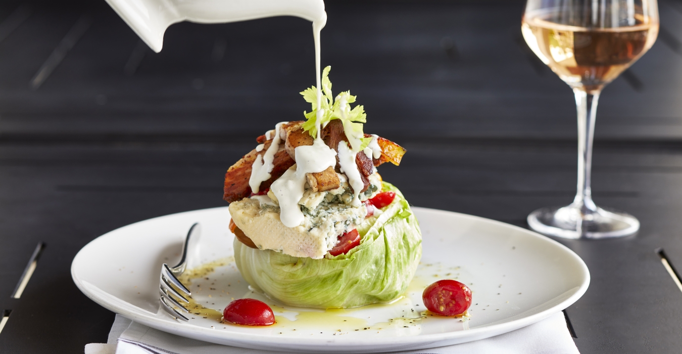 Wedge salad with glass of rose