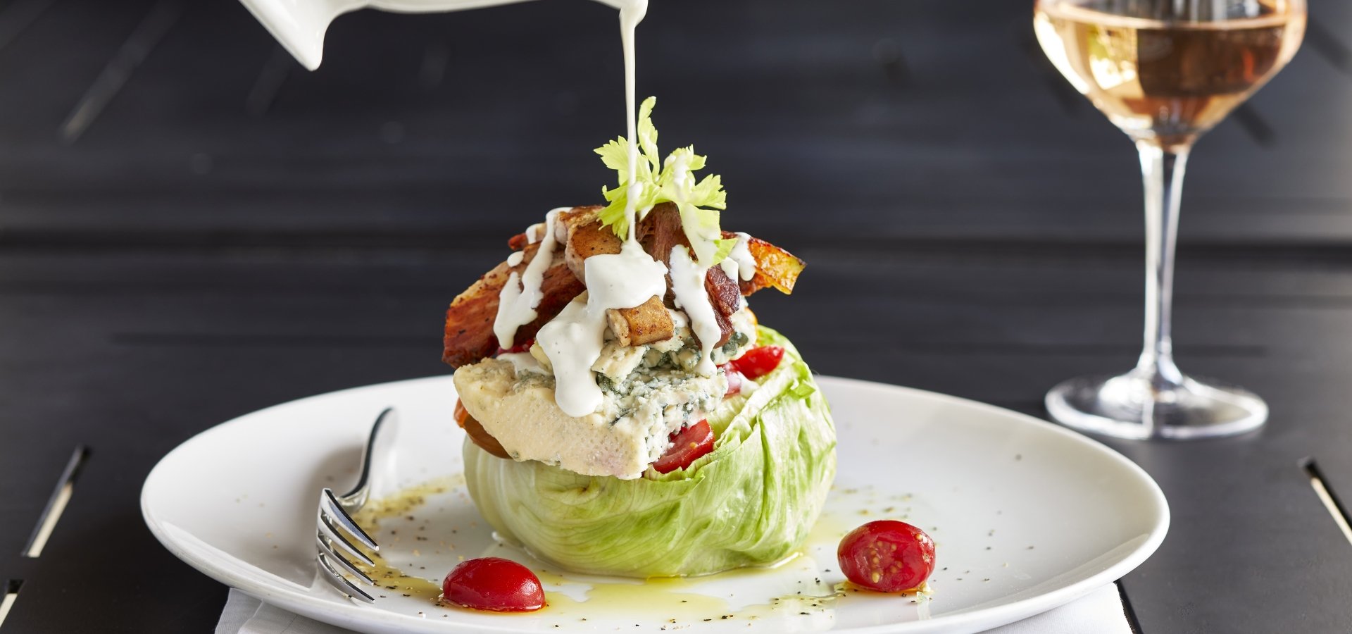 Wedge salad with glass of rose