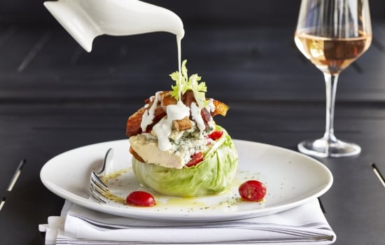 Wedge salad with glass of rose
