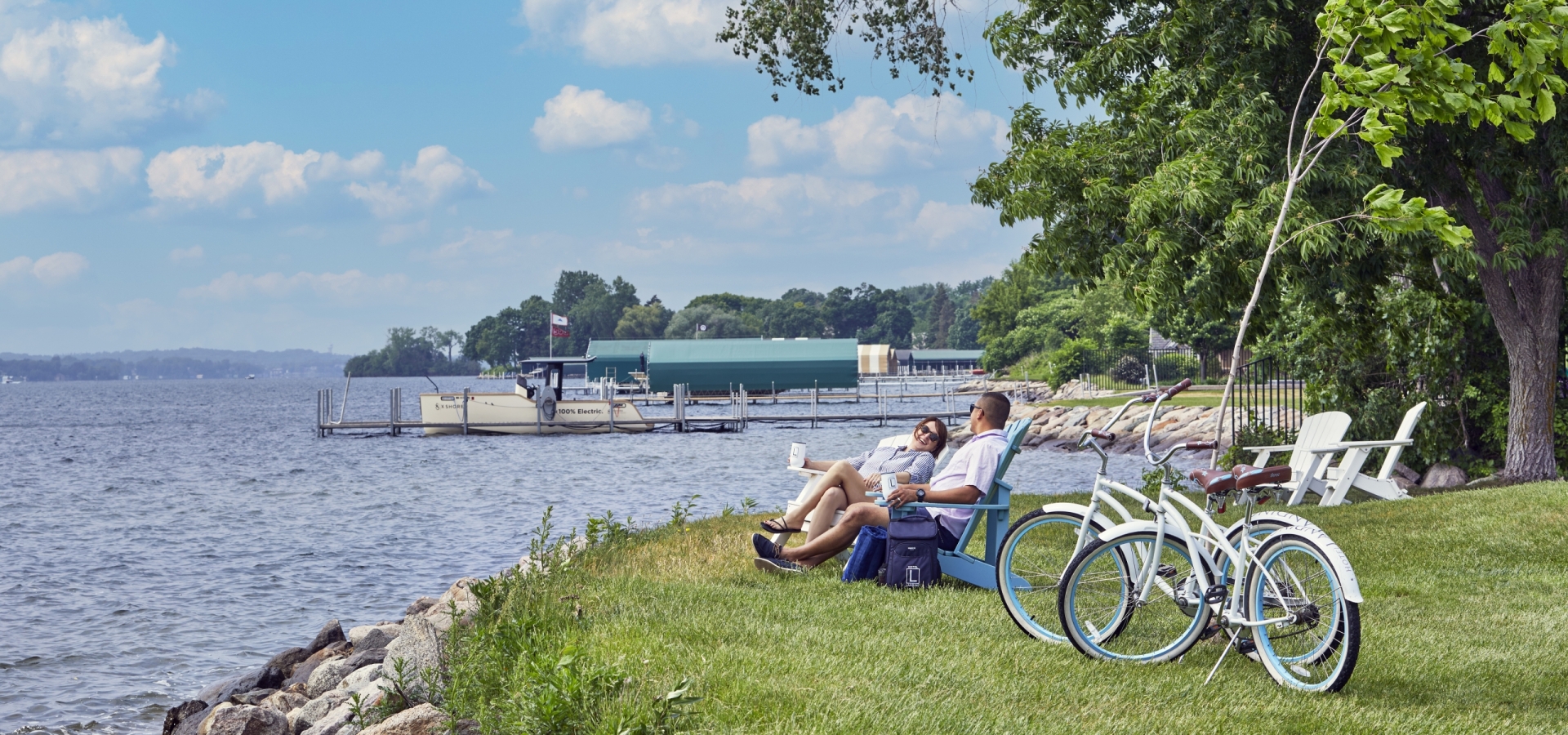 couple enjoying a picnic by the lake