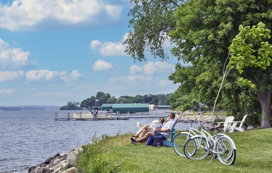 couple enjoying a picnic by the lake