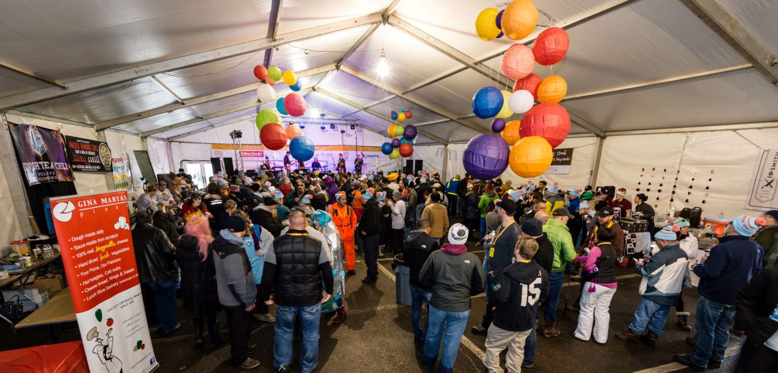 a group of people at a chili tasting competition