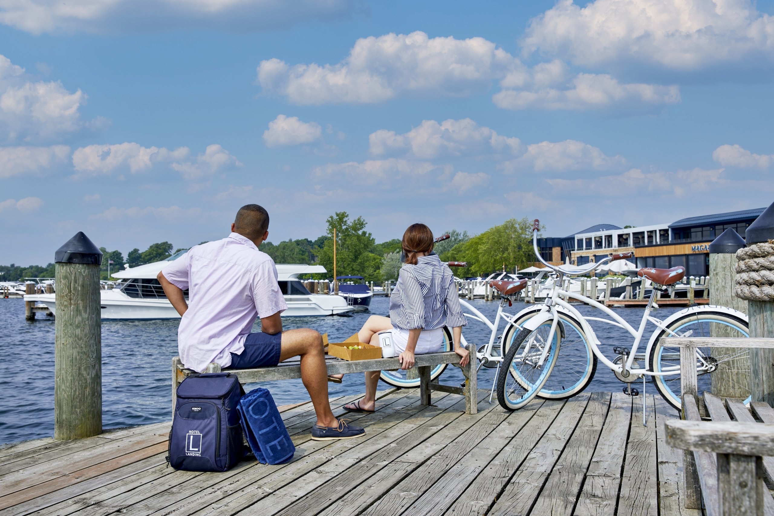 couple having a picnic on the dock with bikes
