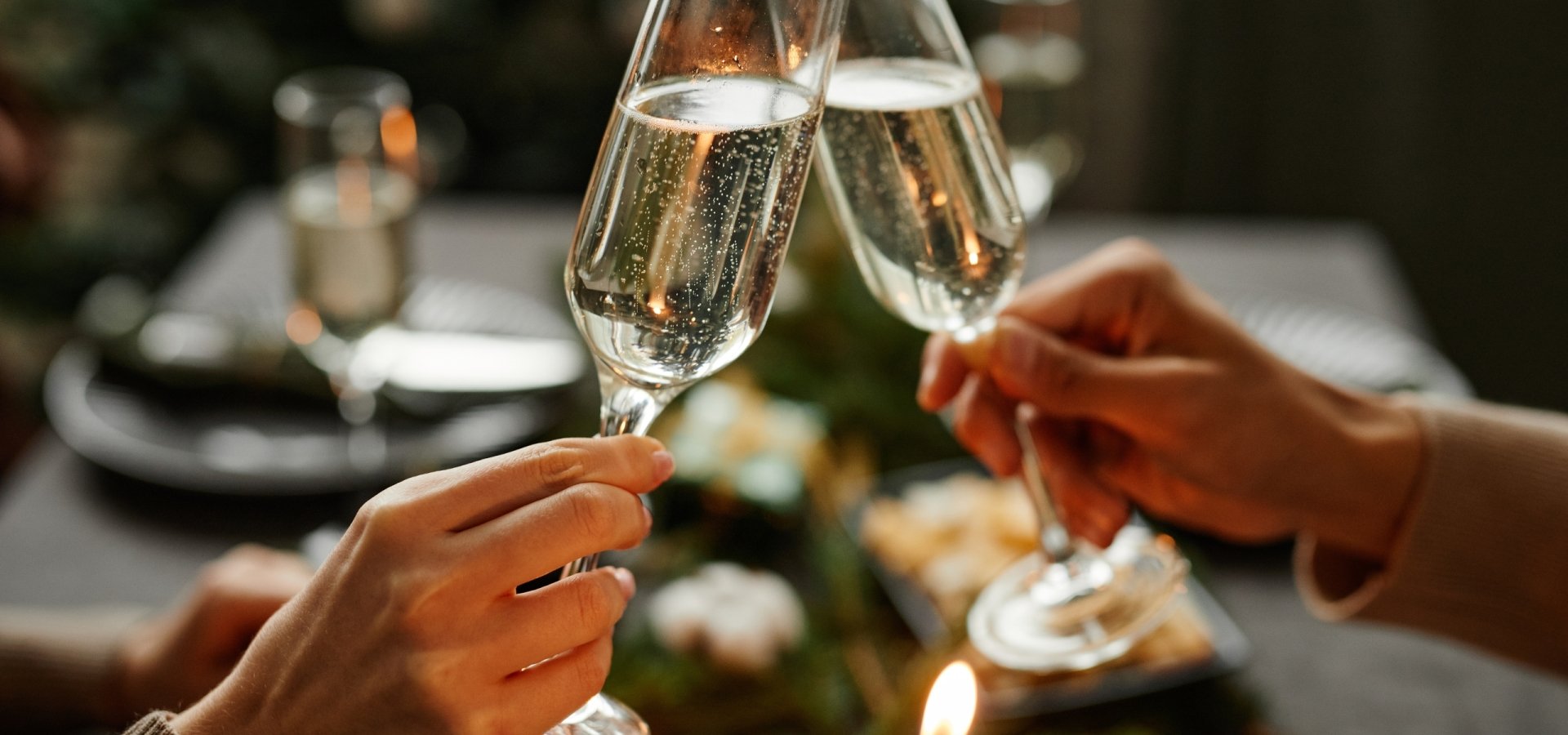 A couple having a cheers at a dinner table